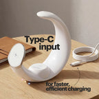 White charging dock with Type-C input on a wooden surface