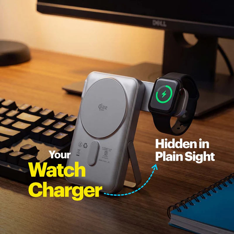 A silver wireless watch charger docked on a wooden desk next to a black keyboard, with a smartwatch attached. Text overlays read 'Your Watch Charger' and 'Hidden in Plain Sight'.