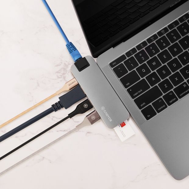 Cadyce CA-DUCDG Dual USB‑C Docking Station packaging displayed beside the device