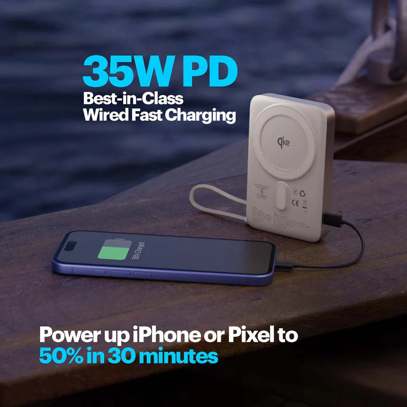 Fast charging device with smartphone on a wooden surface near water