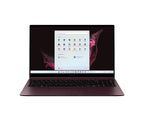 A dark plum-colored laptop shown open and centered on a plain white background, with the screen turned on and displaying a Windows desktop.