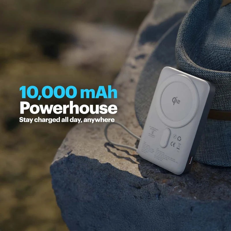 Portable power bank with 10,000 mAh capacity on a rock with a blurred natural background