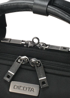 Close-up of a black woven bag with a black leather handle and silver-tone hardware, including two zipper pulls and a metal brand plate reading DICOTA.