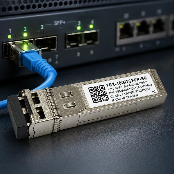 A close-up of a SFP+ laser module labeled TRX-10GIT3FPP-SR, connected via a blue Ethernet cable to an SFP+ switch port. The module is positioned diagonally in the foreground against a dark gray server chassis.
