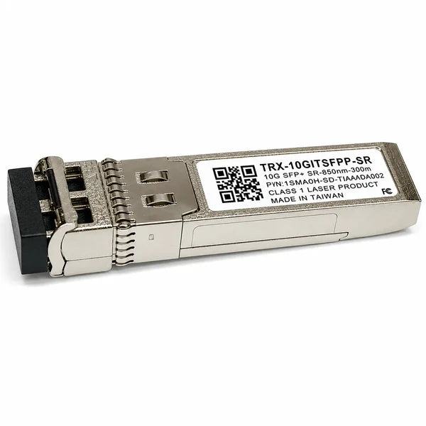An SFP+ optical transceiver module with a silver metal housing, a black connector plug, and a white product label showing model details and a QR code.