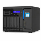A QNAP TC-950X all-in-one network storage system in matte black, featuring a front display screen, six slim drive bays, and a drive module slot on the right side, set against a plain white background.